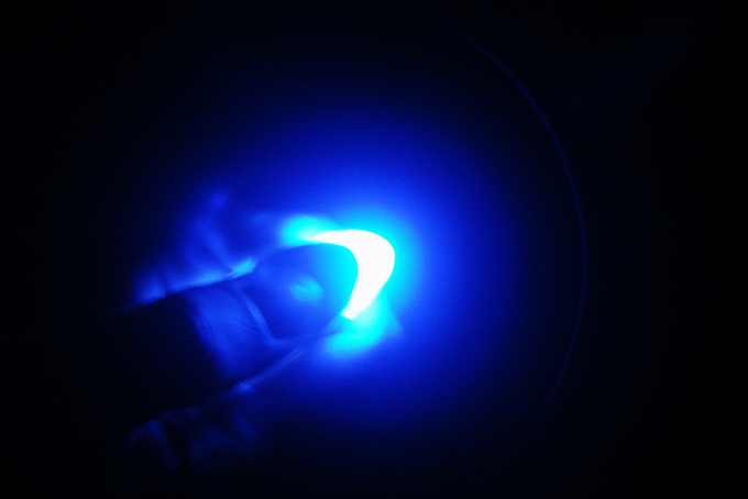 A hand with blue light