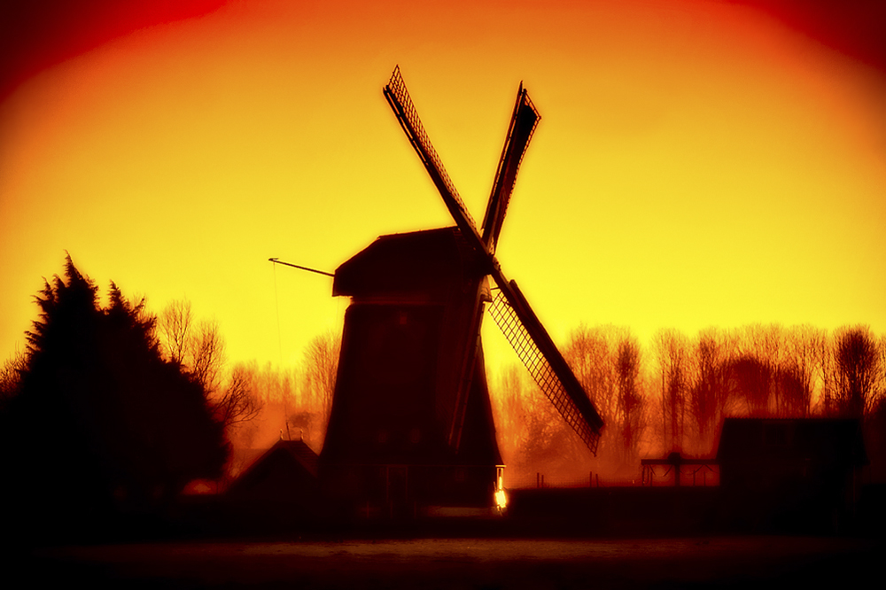 Dutch windmill at the sunset