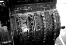 An antique crank-operated cash register