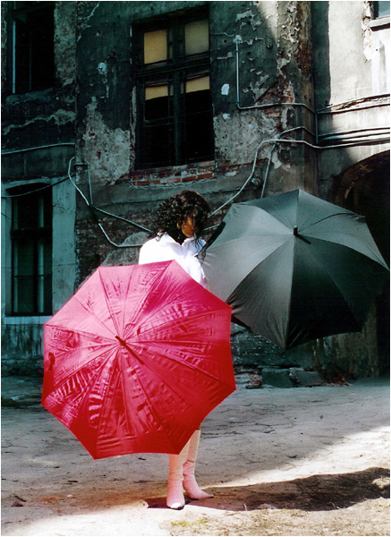 The Girl With Two Umbrellas