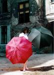 The Girl With Two Umbrellas