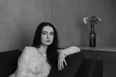 L.